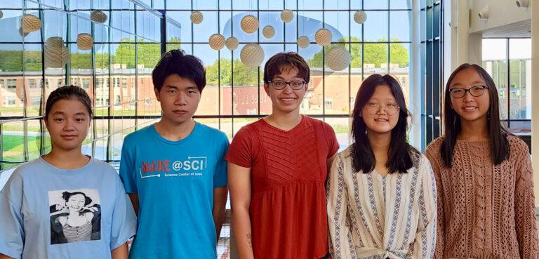 student who qualified as national merit scholarship semifinalists smile at Ames High