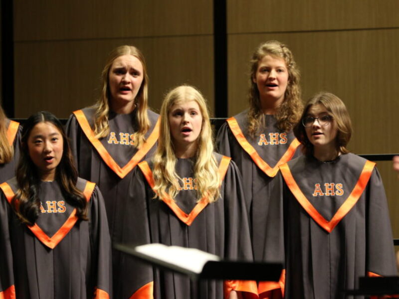 A general view of five AHS choir singers singing
