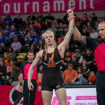 Lexa Rozevink has arm raised by referee after a victory at the 2023 IGHSAU Girls Wrestling Championships (Photo: Adam Atkinson)