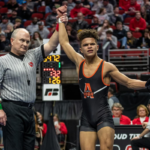 Jabari Hinson collected a semifinal victory with a sudden-victory takedown over Southeast Polk's Maximus Riggins (Photo credit: Adam Atkinson)