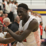 Lucas Lueth and Jamison exchange smiles in the closing minute of an IHSAA Substate Final contest.
