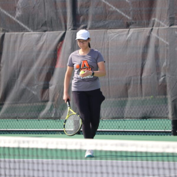 Ames tennis player prepares to serve