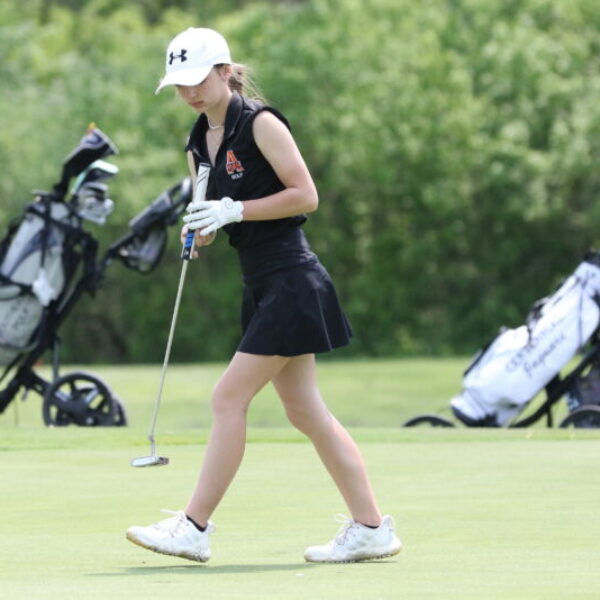 Student playing golf