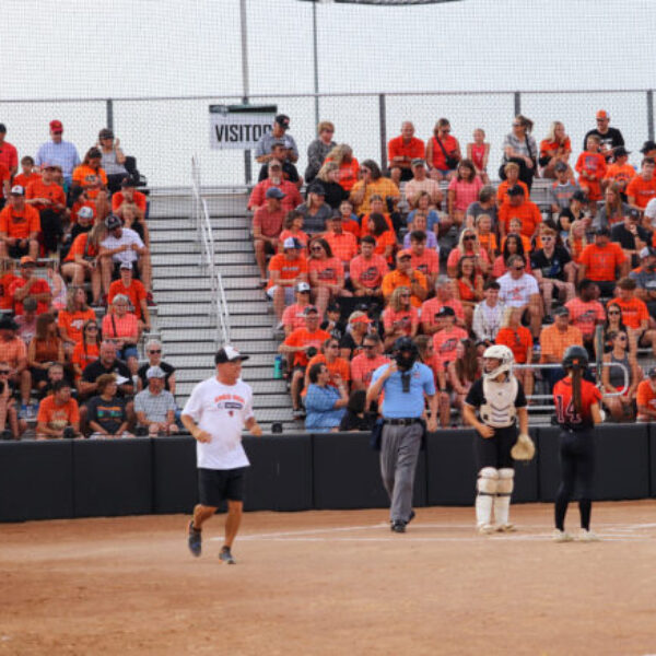 A general view of Ames softball supporters in the stands, mostly wearing orange