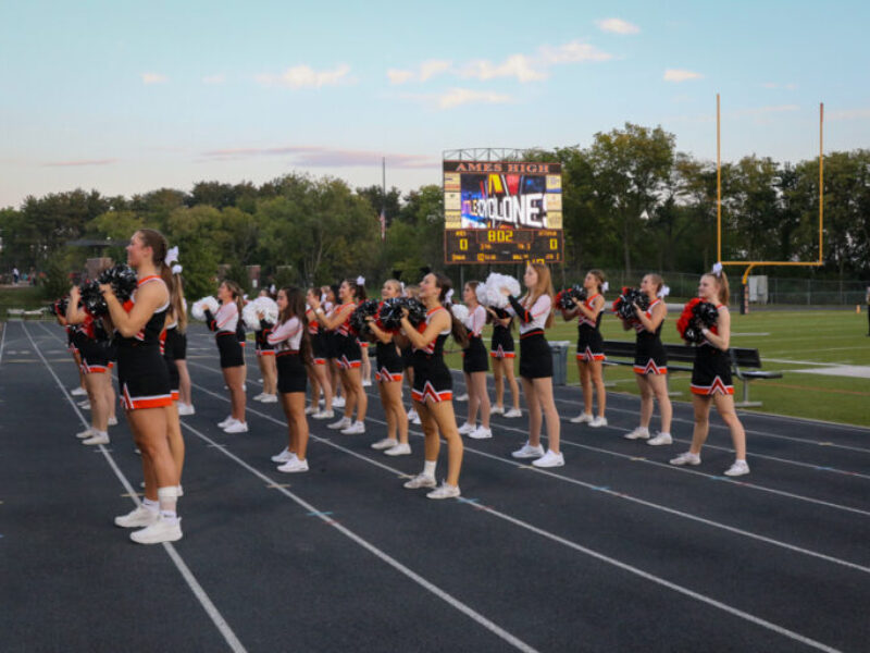 Cheerleaders cheering during a football game