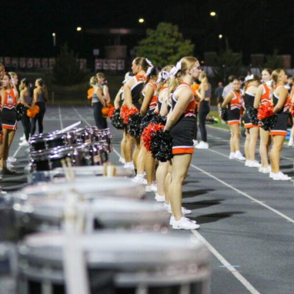 Cheerleaders cheering during the football game