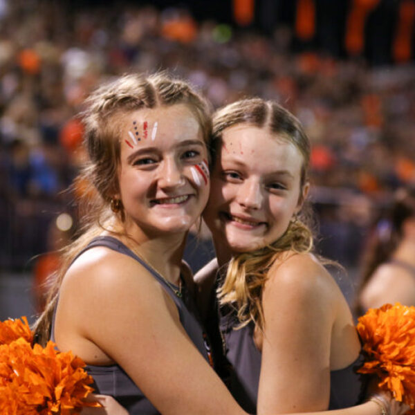 Two members of the dance team smiling.