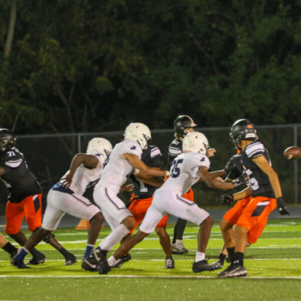 Football players during the homecoming game.