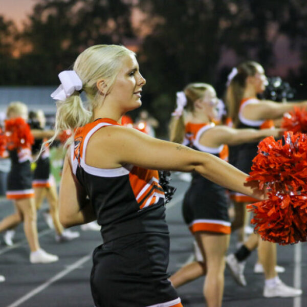 Cheerleaders cheering during the football game