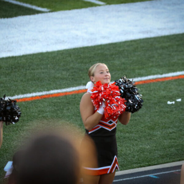 Cheerleaders cheering during the football game