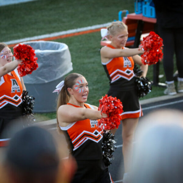 Cheerleaders cheering during the football game