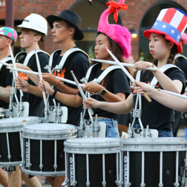 students playing drums in the band for the parade