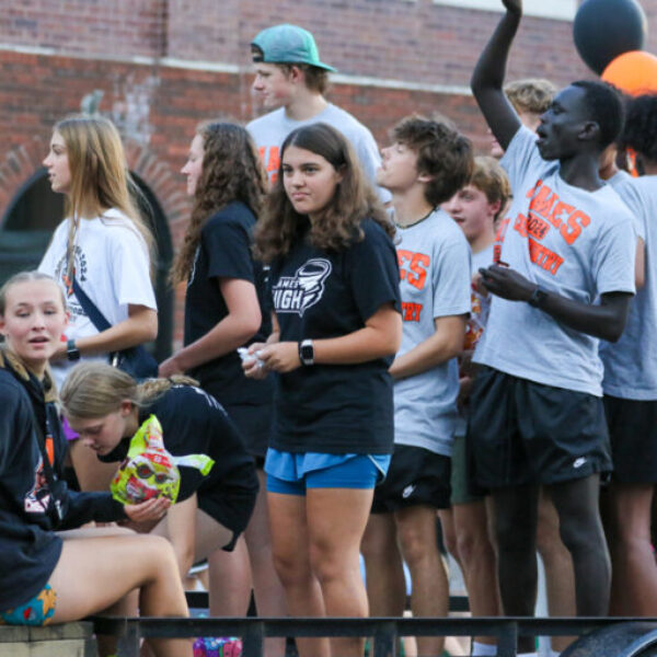 Cross country teams in the homecoming parade