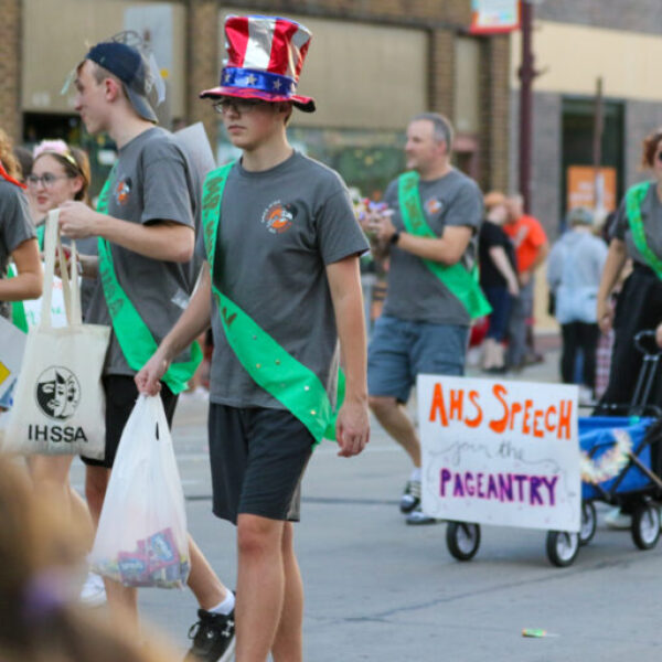 members of Ames High speech walk in the parade