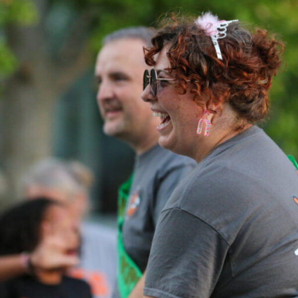 Coaches for Ames High Speech smile in the parade