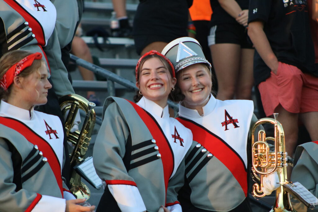 Two marching band students posing for the camera