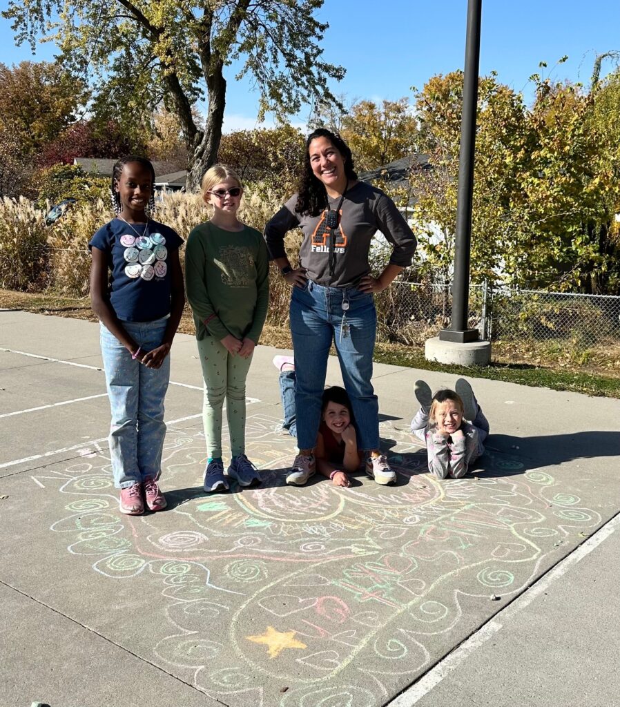 4th grade students and their teacher enjoying a sunny afternoon