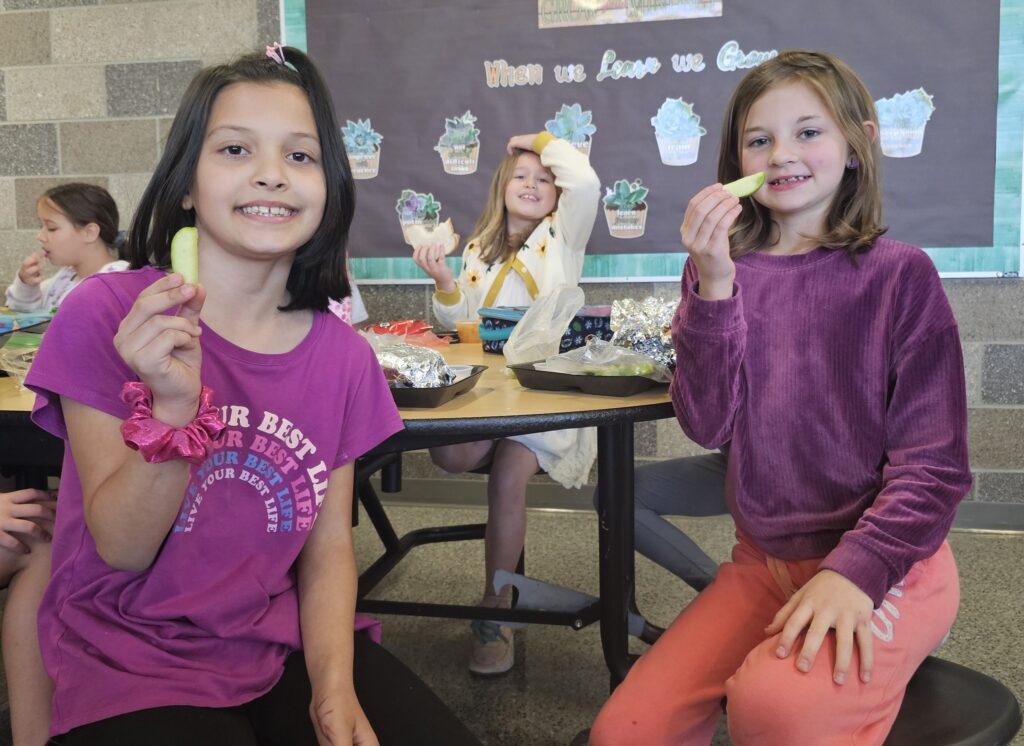 Students enjoying their lunches on National Apple Day