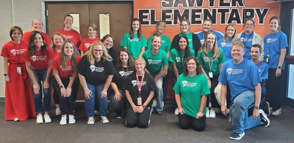 Staff showing off their house color shirts